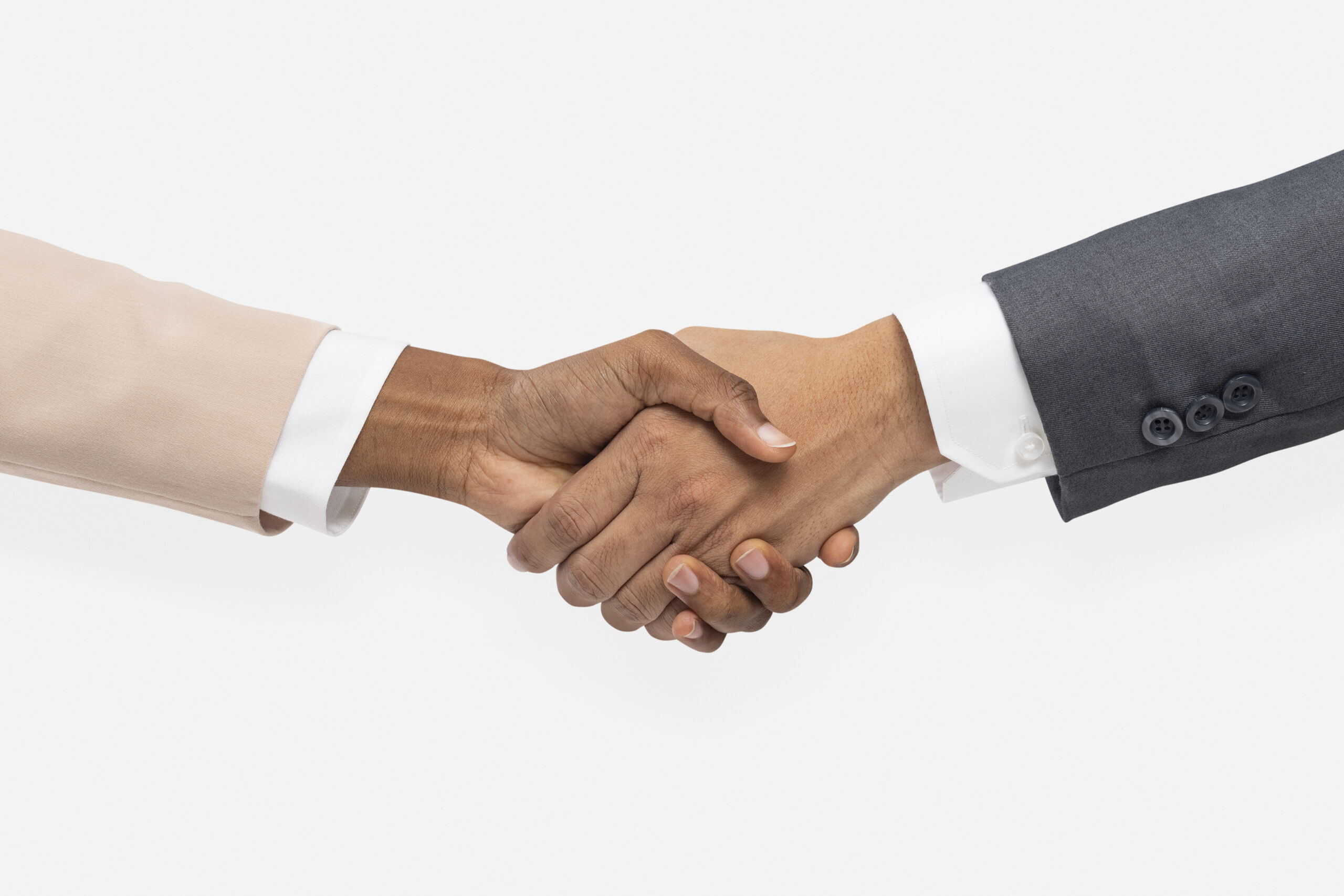 Business partnership agreement represented by a handshake